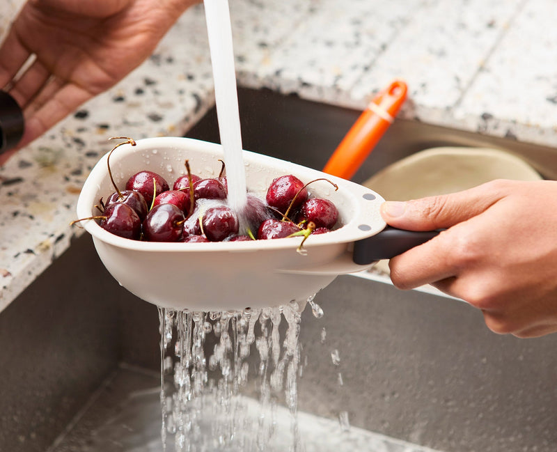 Load image into Gallery viewer, Joseph Joseph Droplet Mini White Colander with Folding Handle
